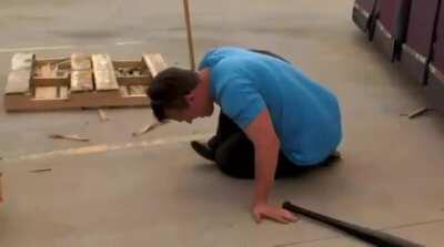 Trying to smash the car with a bat