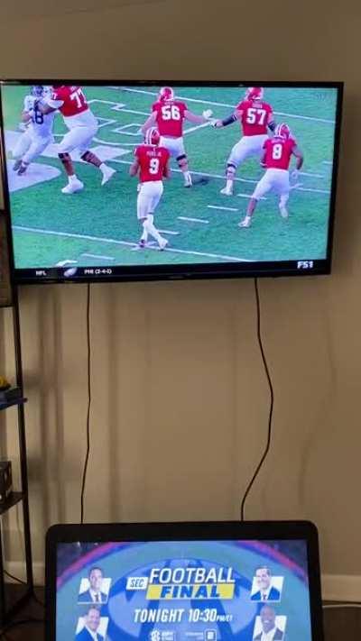 This lady cheering for her son at IU football game.
