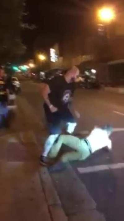 Bouncer casually doing his job.