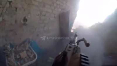 A soldier of the Kraken battalion from the GUR firing his H&K MG5 at Russian forces, in the town of Chasiv Yar in Donetsk region.