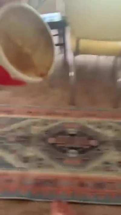 Playing chicken with a cup of coffee over a laptop