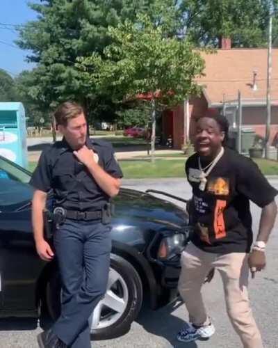 Black guy calling out pigs makes crakkkers angry