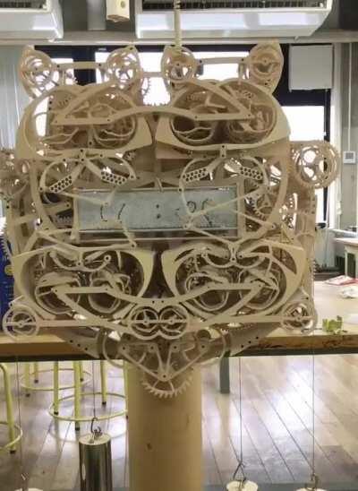 An intricate clock that writes the time out every minute