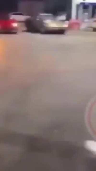 Woman gets jumped after throwing rock at car