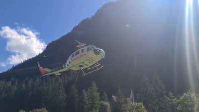 Bell 205 A1 taking off to transport logs in Austria