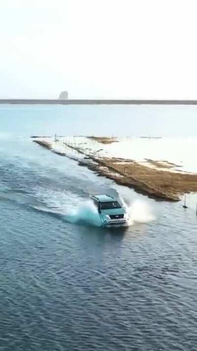 Driving through this flooded road in Iceland