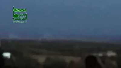 Opposition fighters look on at a sustained SyAAF/Russian cluster strike on positions outside of Hama - 10/11/2015