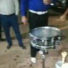 Pouring gasoline on a drum