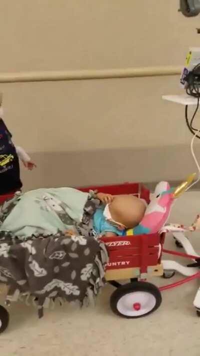 He takes his little buddy on a ride in his “Radio Flyer” wagon. r/humansbeingbros