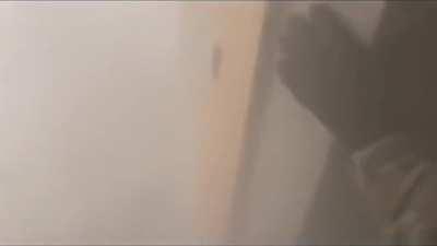 Ukrainian soldier fires a recoilless rifle indoors