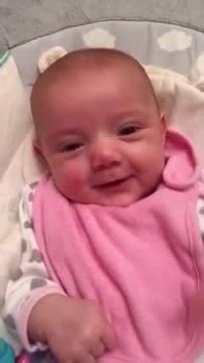 8 week old cute baby mimicking mom's 