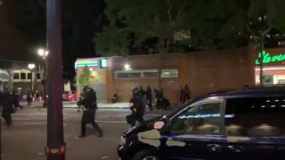 Portland police bull rush protesters