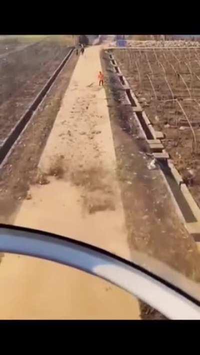 Helicopter pilot spots man sweeping floor, so decides to help out!