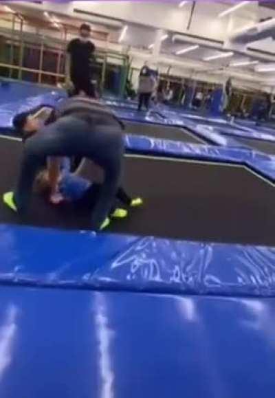 Kid runs onto trampoline, trips and gets hit