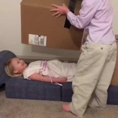 A kid's magic trick to saw his sister in half!