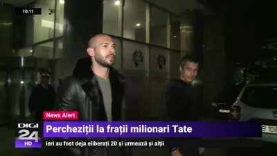 a video from a Romanian news outlet showing Andrew tate being released