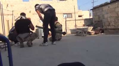 FSA fighters confer before engaging Syrian Army positions in a sugar factor with an M79 Osa - al-Hajr - 2013