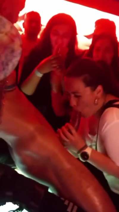 Girl sucks male stripper on stage