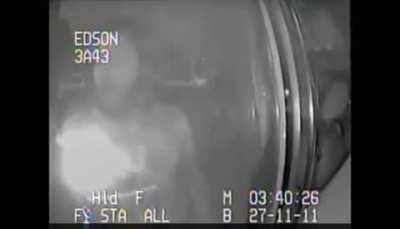 Man sings Bohemian Rhapsody on the back of a cop car