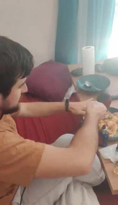 Watching my friend's soul slowly leave his body as he uses a hair dryer to warm up his food