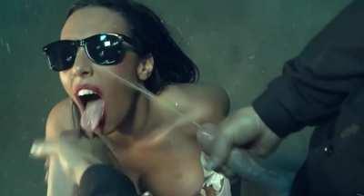 girl in sunglasses gets sprayed by two cocks simultaneously