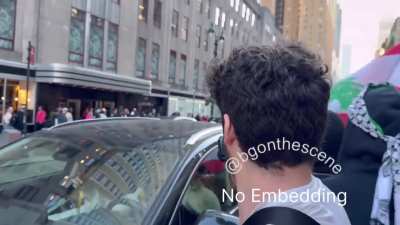 Protesters in NYC surround a car