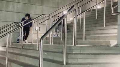 My friend headbutting a rail