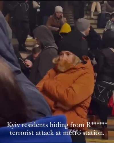 Kyiv residents hiding in subway stations. Bonus appearance by a tucked in ginger kitty 🐈