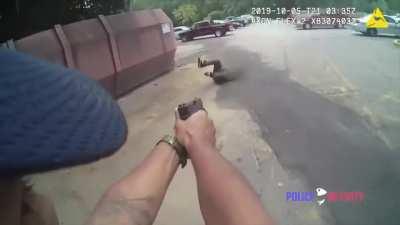 Policeman dodges machete swing