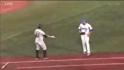 Edwin Escobar high fives Takayuki Kajitani for the out