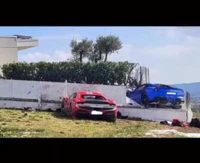 Pair of Ferraris race in a neighborhood and both lose control