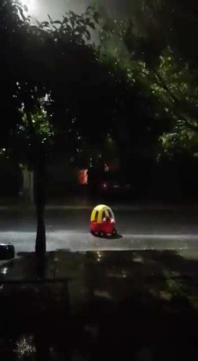 This car on the street during a storm in Mexico.