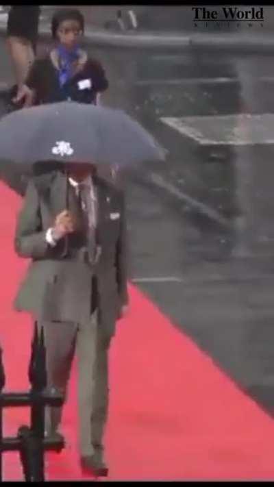 Prime Minister Shehbaz Sharif walked away with an umbrella from a woman and left the house drenched