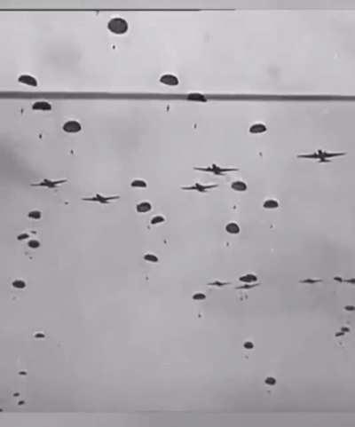 American paratroopers parachuting during Operation Market Garden (1944, B&W). [WWII]