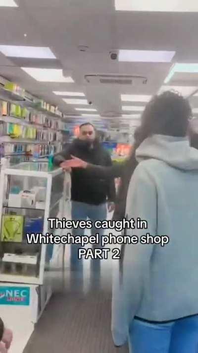 Thieves were caught inside a phone shop in Whitechapel. The people locked the door so the thieves couldn't escape. The thieves were yelling to have the door unlocked, but the people didn't listen and kept the door locked. PART 2.