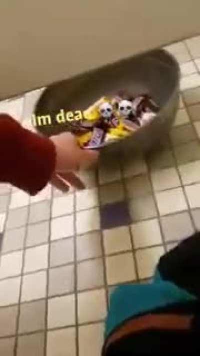 Guy offers candy to his neighbours while they poop