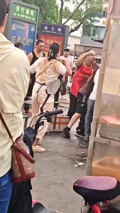 A woman poured a bowl of boiling water onto another woman, which caused her to scream.