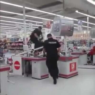 Drunk guy hiding from cops at a check out stand