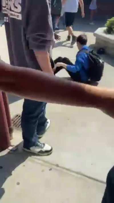 Kid in Blue was talking shit so the kid in white slapped him and they started fighting