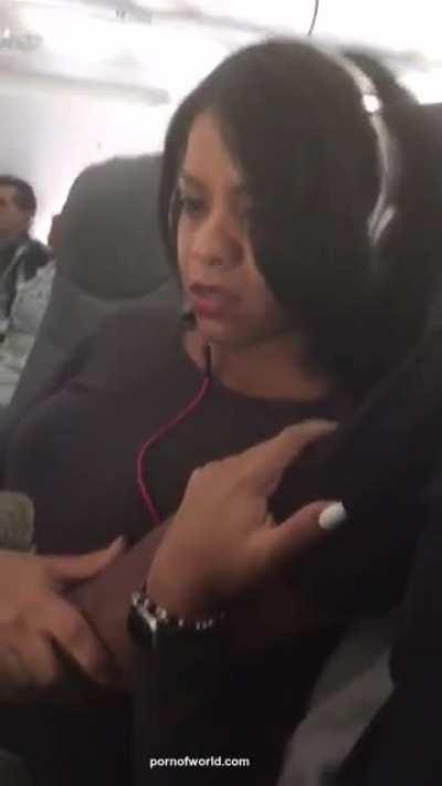 Fingering his gal on the Plane