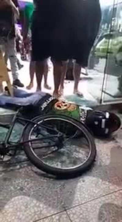 Guy slips on broken glass then kicks dead body