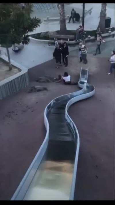 HMC while i flip of a little kid before going down a slide