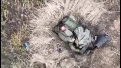 Ua pov Ukrainian drone drops a grenade on two Russian soldiers sleeping in a foxhole