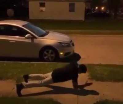 Saw an unnamed superhero on the sidewalk.