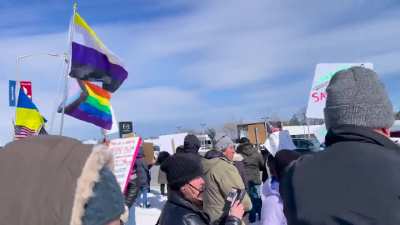 300 anti Trump protesters vs 20 Trump supporters outside Tesla in Illinois, lake county.
