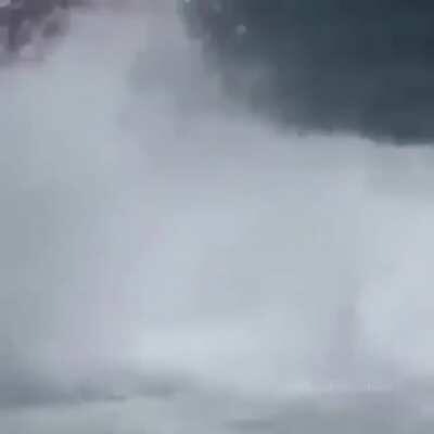 Driving straight into a breaking wave that overturns the boat