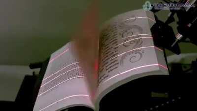 No manual page flipping book scanner. 250 pages per minute. (2012)