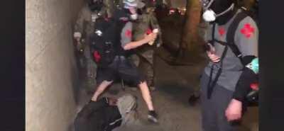 Feds in Portland beat medics trying to help defenseless man on the ground.
