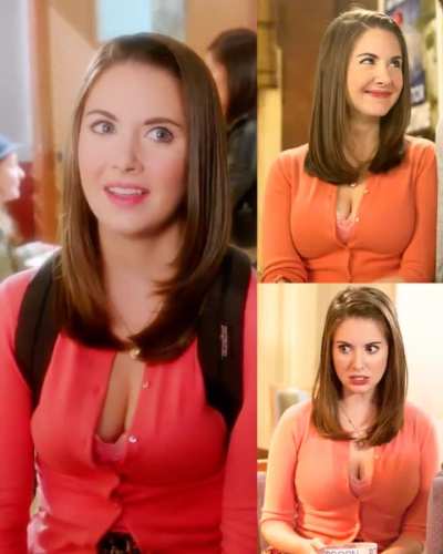 Annie being the epitome of beauty in a salmon cardigan