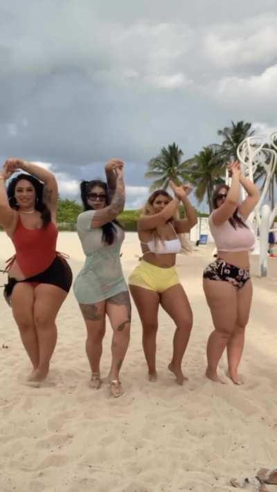 Four big booty models at the beach.